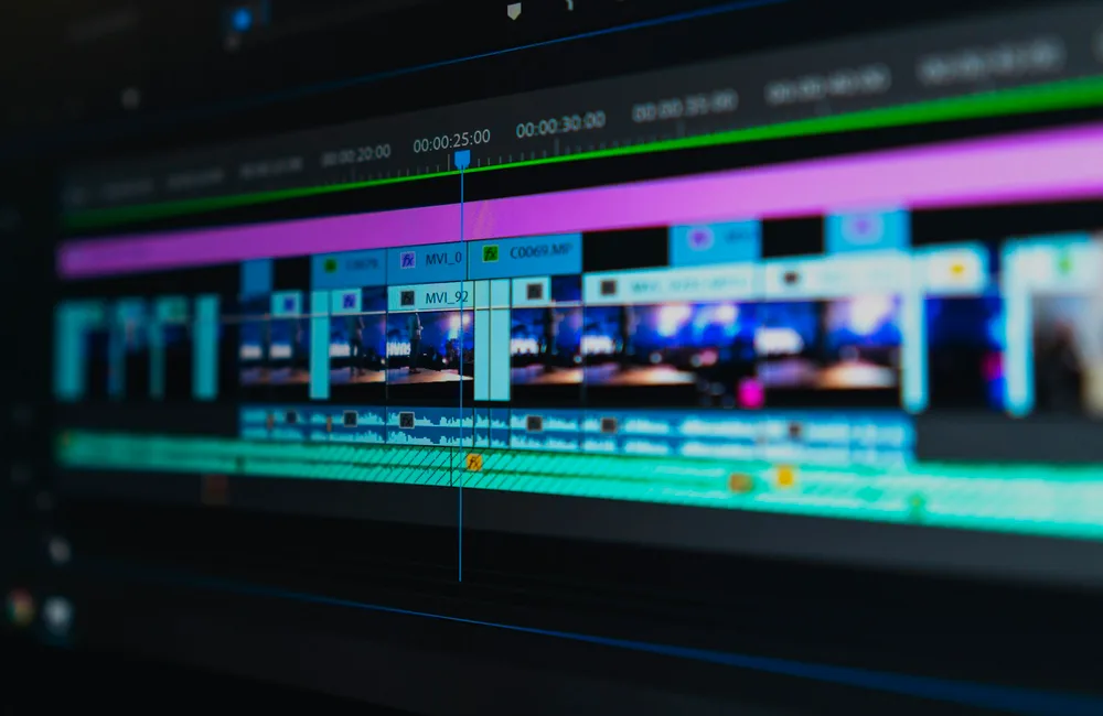 Cinematic studio camera and monitor displaying video lessons for Digital Product Empire Masterclass
